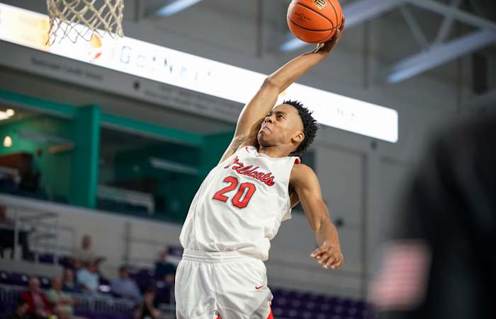 Lake Highlands Wildcats guard Tre Johnson (20) goes up for a dunk during the second half of a game against the Newton Rams during the 49th annual City of Palms Classic at Suncoast Arena in Ft. Myers on Friday, Dec. 16, 2022. Lakehighland V Newton Cop 0001